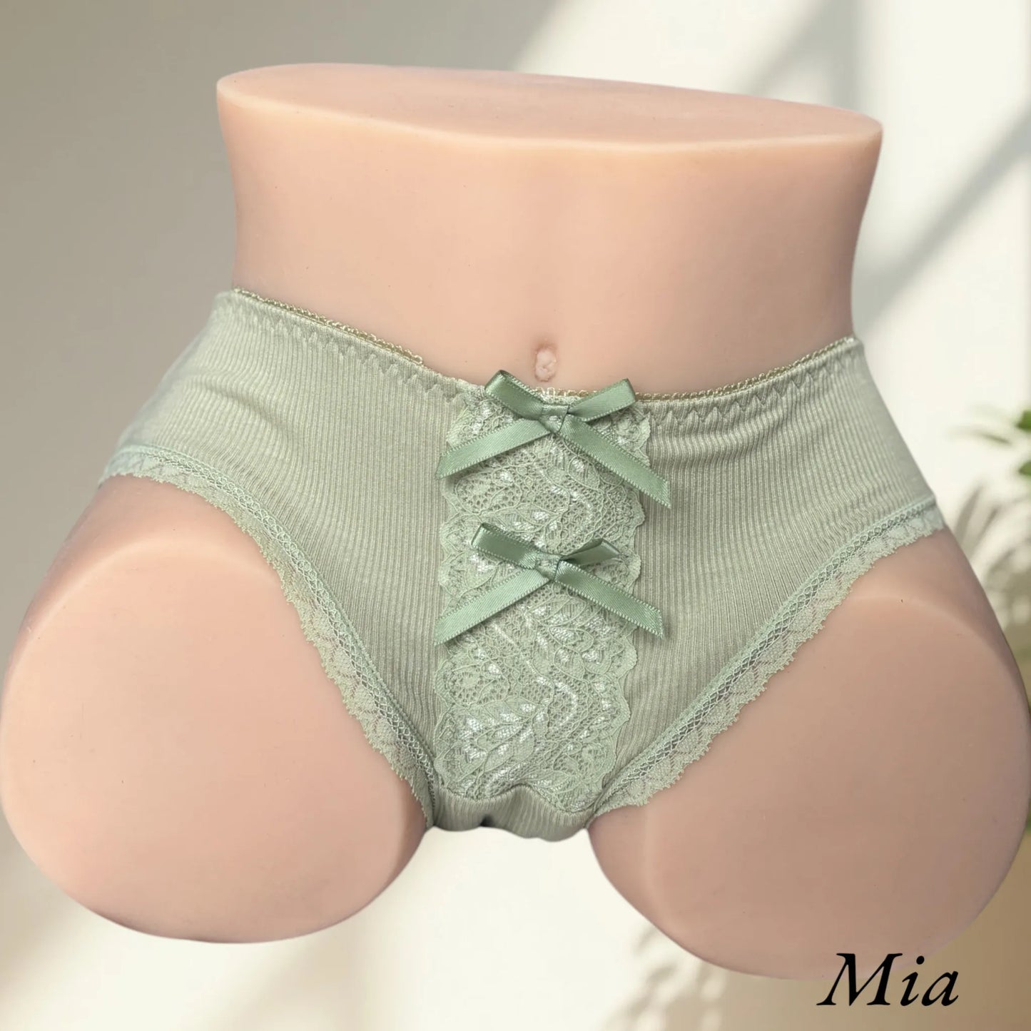 Mia wearing green lingerie ribbon panties front view