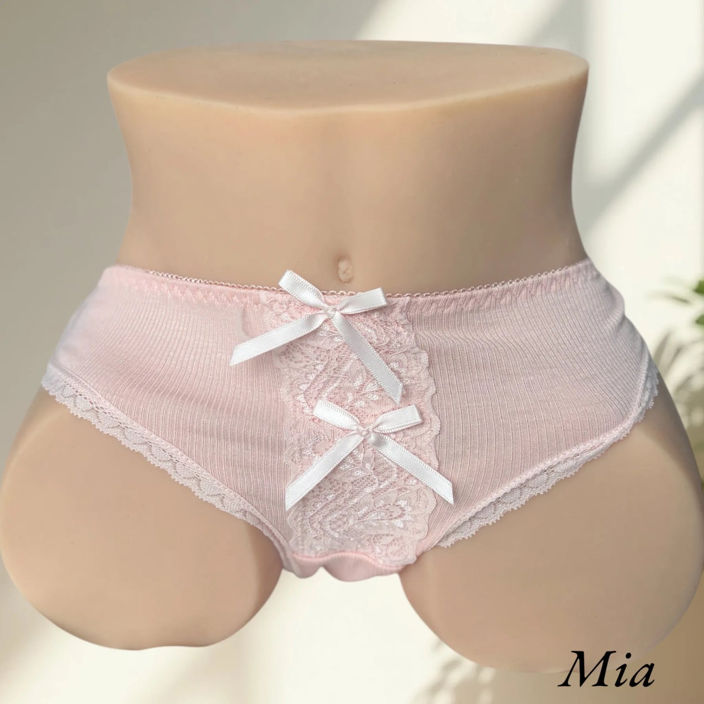 Mia wearing pink lingerie ribbon panties front view