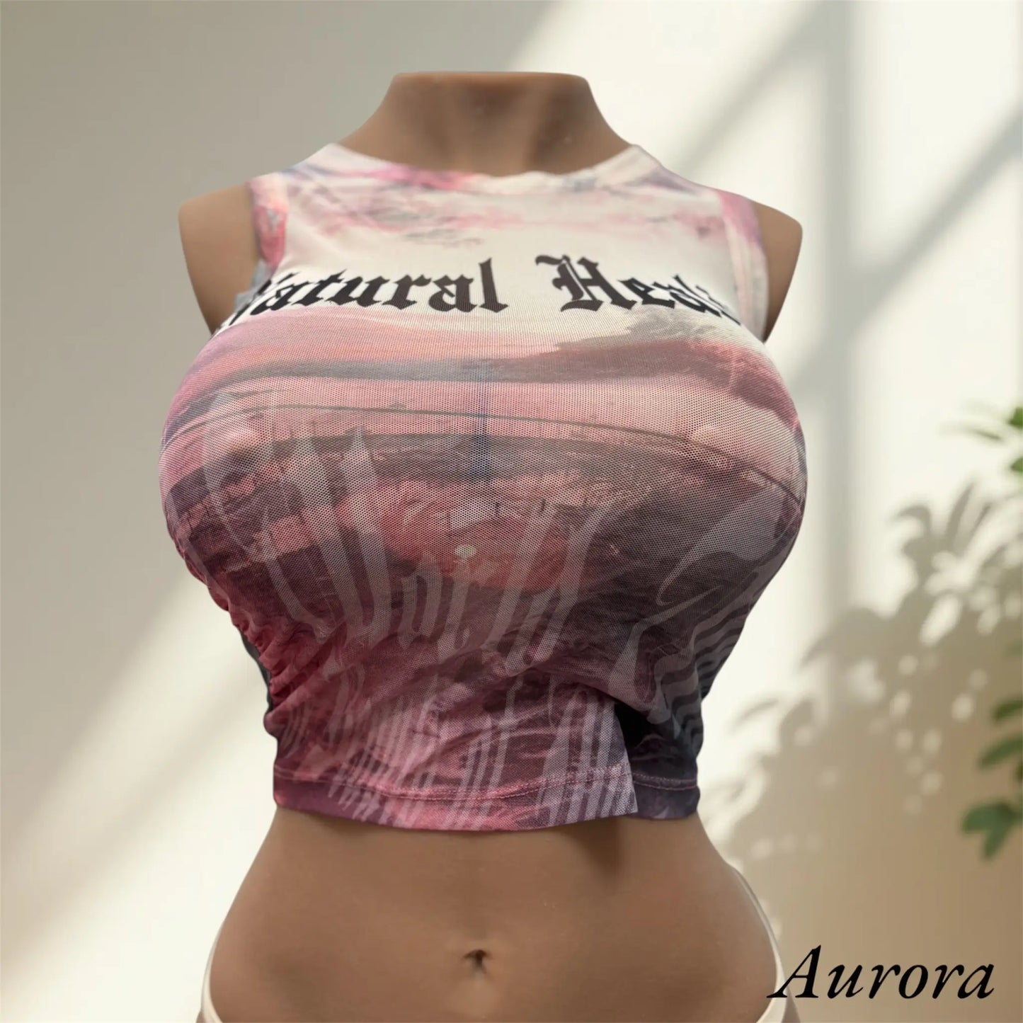Aurora wearing natural healing top