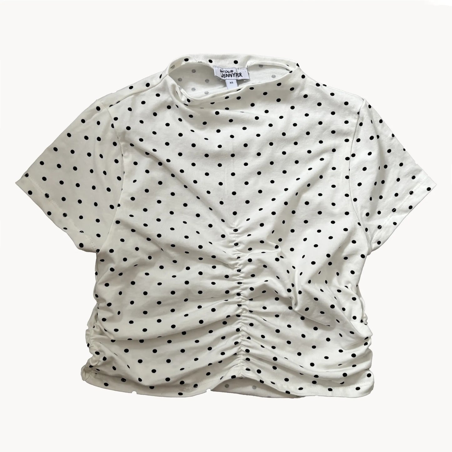 presentation of a white top with black spots