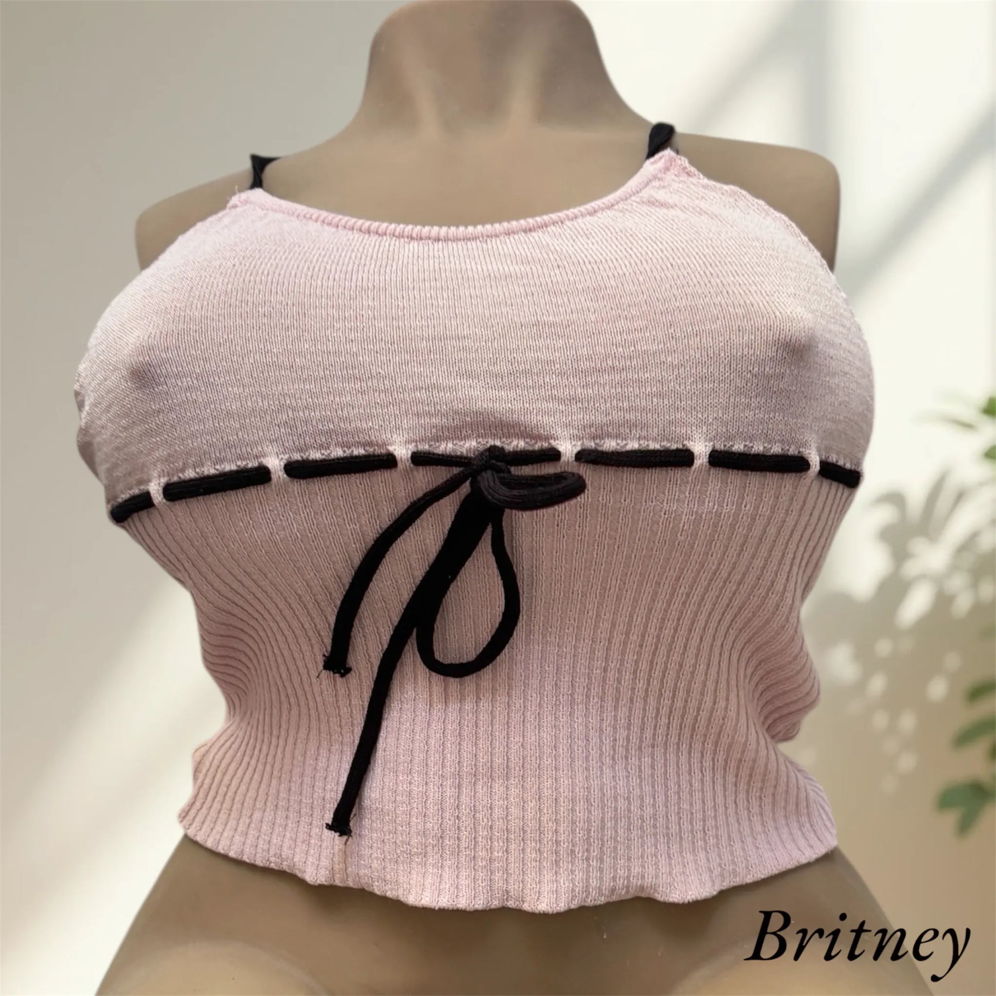 Britney wearing a lace pink top