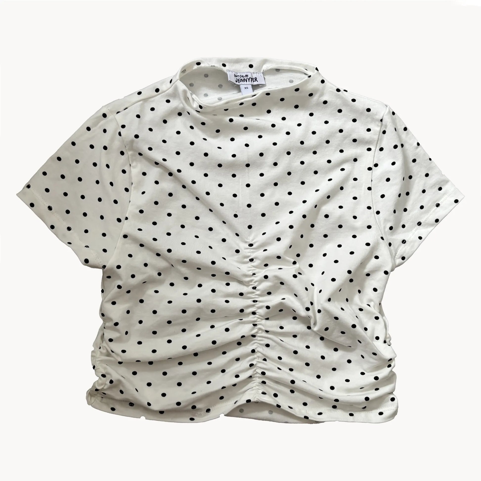presentation of a white top with black spots
