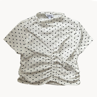 presentation of a white top with black spots