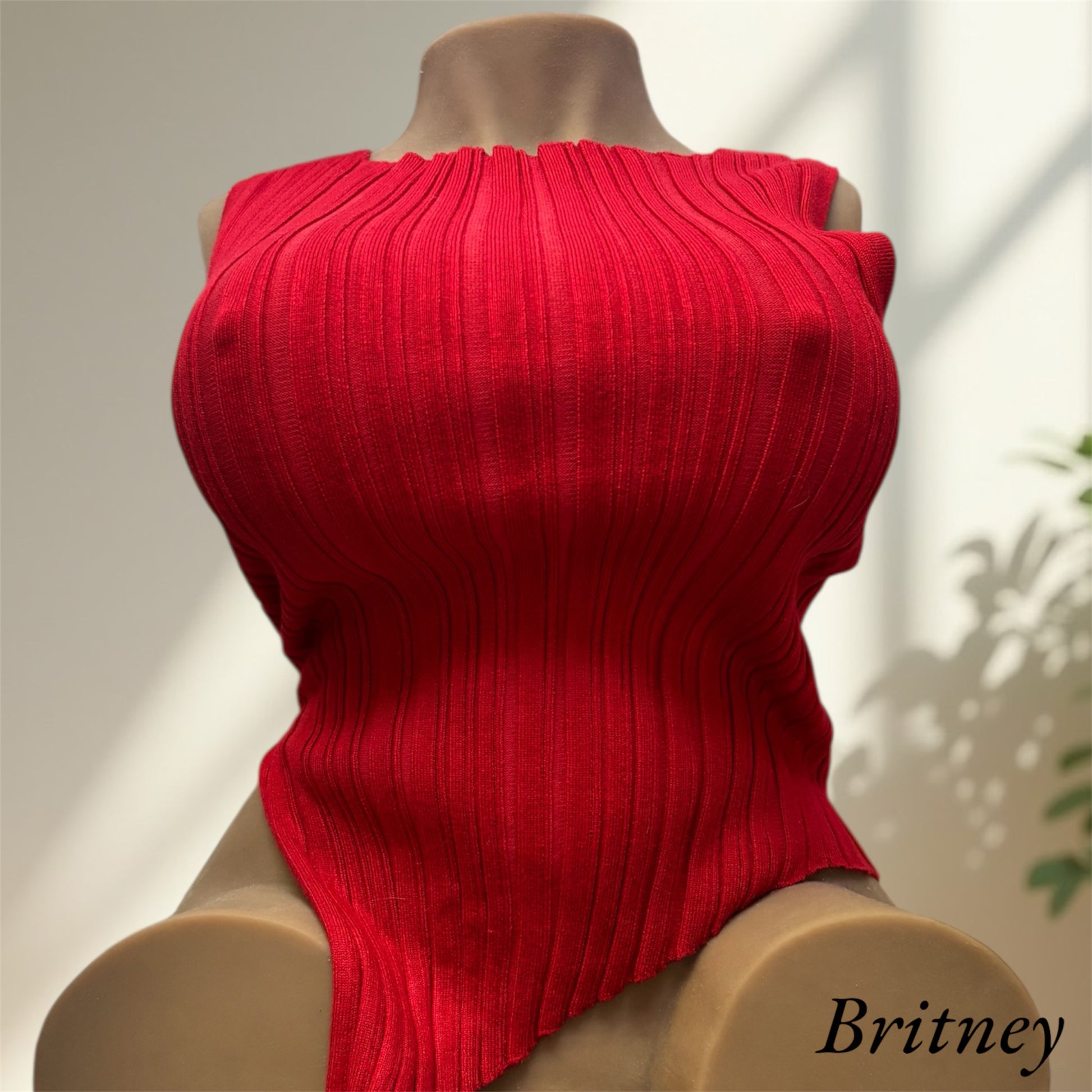 Britney wearing a red long shirt